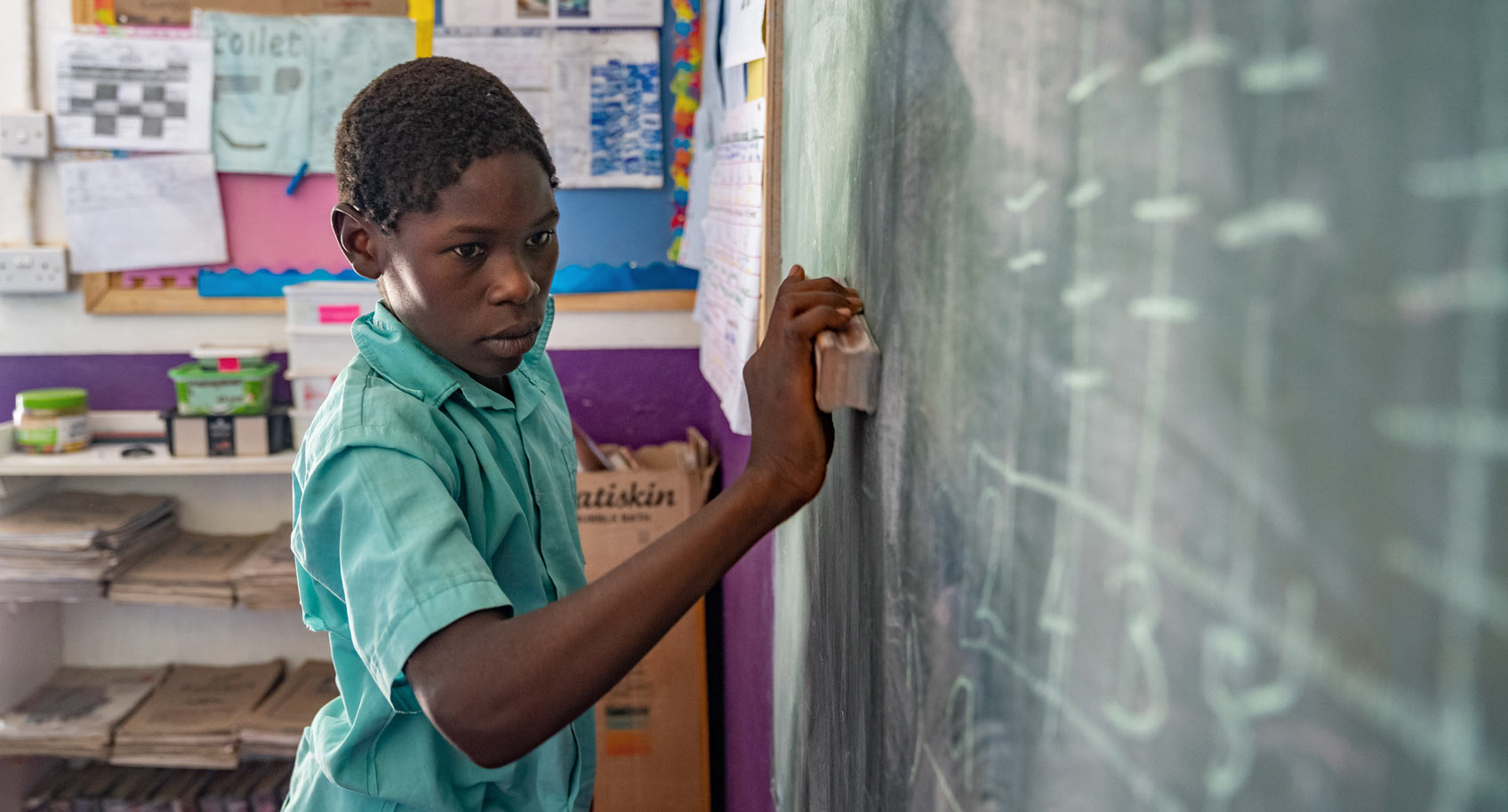 Photo of boy at blackboard in Zimbabwe